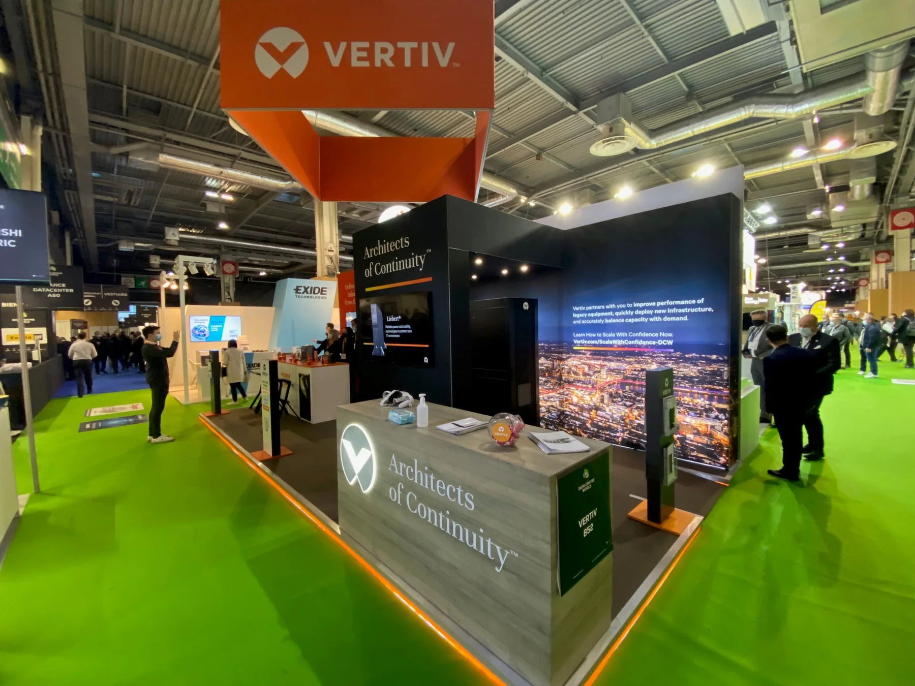 LED backlit event graphics with overhead branding and AV